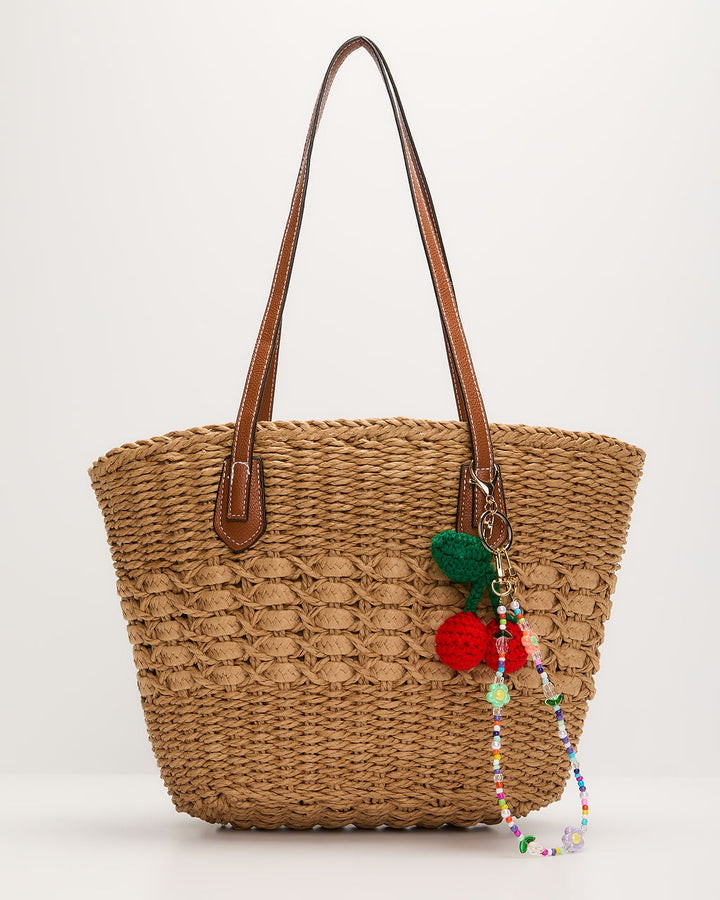 Nylah Woven Charm Straw Tote Bag